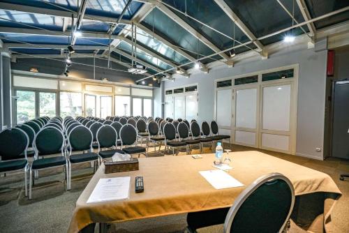 a conference room with a long table and chairs at Hôtel Saphir Lyon in Lyon
