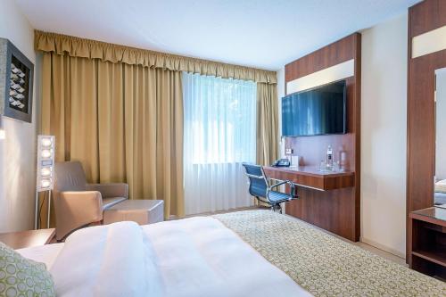Giường trong phòng chung tại Best Western Macrander Hotel Frankfurt/Kaiserlei