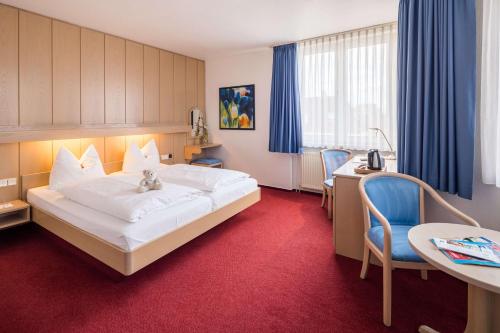 Llit o llits en una habitació de Best Western Hotel Heide
