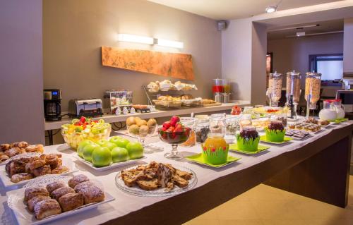 a buffet line with many different types of food at Best Western Hotel Metropoli in Genova
