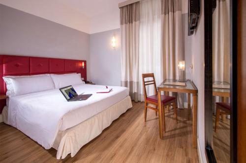 Una cama o camas en una habitación de Best Western Hotel Astrid