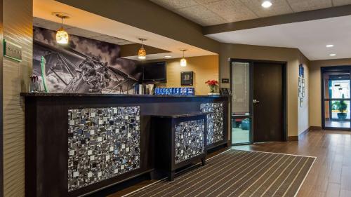 a bar in a lobby with a fireplace at Best Western Plus Wichita West Airport Inn in Wichita