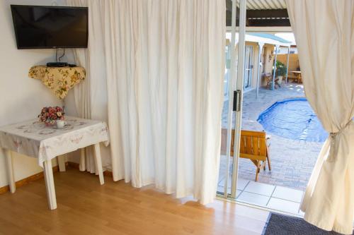 Πισίνα στο ή κοντά στο De Helling Self Catering