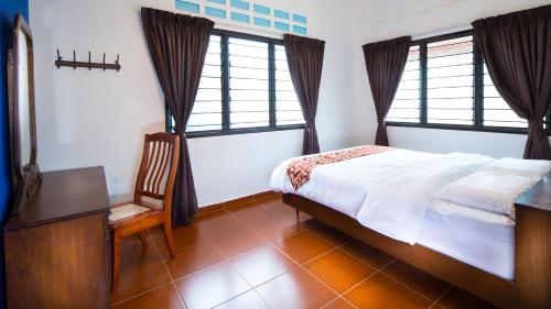 Katil atau katil-katil dalam bilik di SingVillage Holiday House