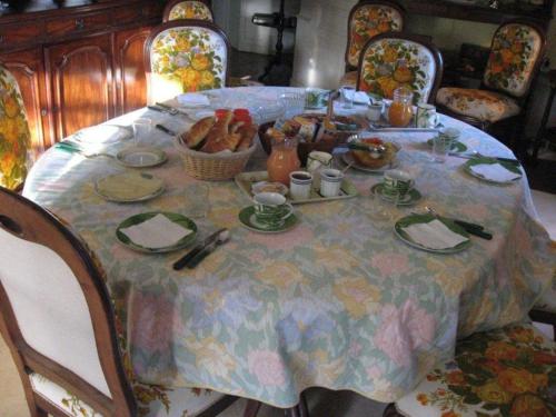 a table with a table cloth with food on it at Le Belvédère,double room in Bléré