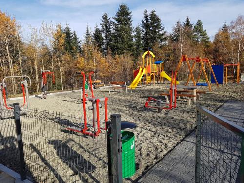 a playground with a bunch of playground equipment at Gniewnik in Pcim