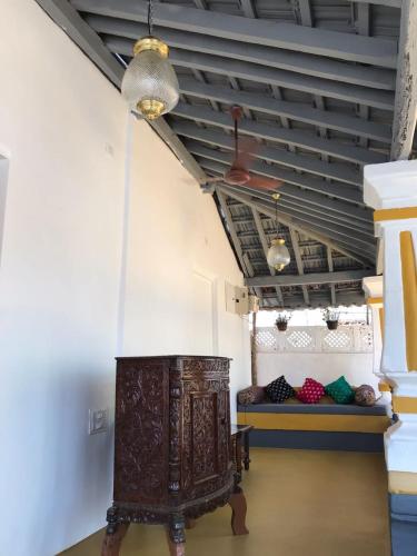a room with a large wooden chest in a room with a bed at Craft Hostels in Anjuna