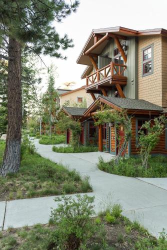 a house with a walkway in front of a building at Cabins 13 in Old Mammoth