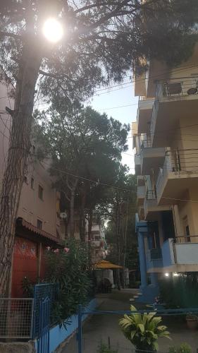 a building with a tree in front of it at Lovely Apartment in Golem