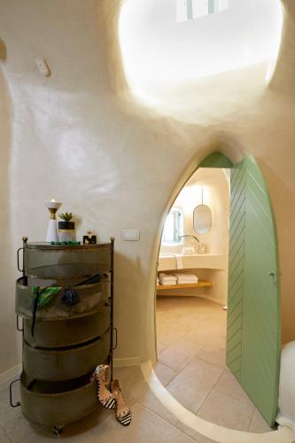 a room with a surfboard on the floor at Gitsa Cliff Luxury Villa in Imerovigli