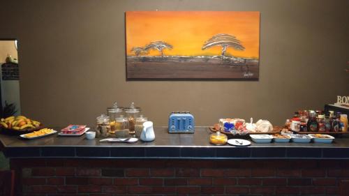 a counter with food on top of it at 24 Onvrey Guest House in Boksburg