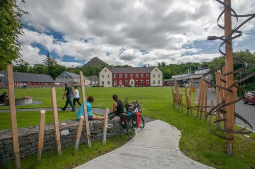 a group of people sitting on a motorcycle in a park at Apartment 708 Letterfrack in Letterfrack