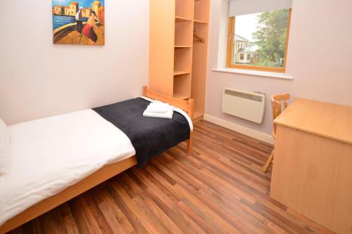 מיטה או מיטות בחדר ב-Apartment 708 Letterfrack