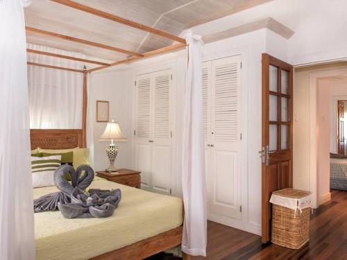 a bedroom with a bed with a towel on it at BEST LUXURY SPOT - HOLETOWN in Saint James