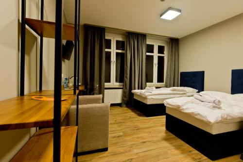 Postel nebo postele na pokoji v ubytování ApartHotel I SORAU