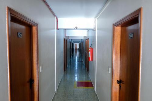a hallway of an office building with a long corridor at Hotel Almanara Cuiabá-Mato Grosso-Brasil in Cuiabá