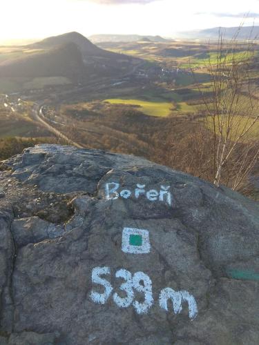 a rock with the words rebel on top of it at Dům na návsi in Teplice