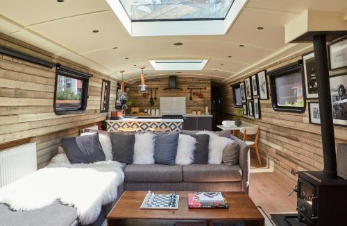a living room with a couch and a table at The Boathouse in London