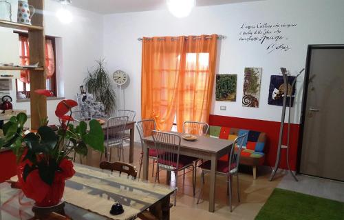 a dining room with a table and chairs at La Dimora Degli Artisti in Catanzaro