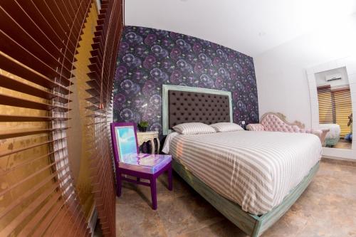 Uma cama ou camas num quarto em Hotel Finca Naranjal