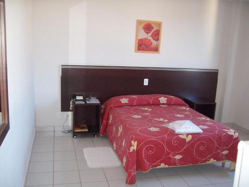 Ένα ή περισσότερα κρεβάτια σε δωμάτιο στο Hotel San German