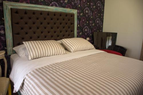 Uma cama ou camas num quarto em Hotel Finca Naranjal