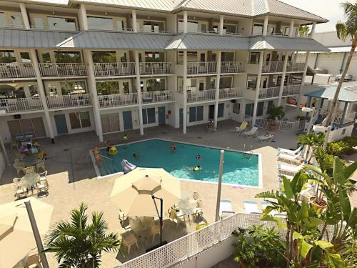 an aerial view of a large hotel with a swimming pool at Pirate's Cove Resort and Marina - Stuart in Stuart