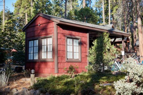 a red shed with windows in a garden at Evergreen Lodge at Yosemite in Groveland