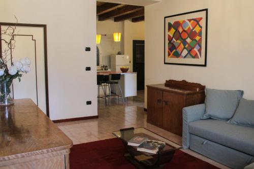 a living room with a couch and a table at Casa Mamò (Cesena Centro) in Cesena