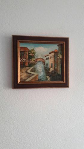 a picture of a painting hanging on a wall at 3- х комнатная квартира в центре in Rivne