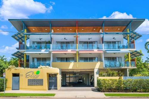 a large white building with a blue sky at Elsey on Parap in Darwin
