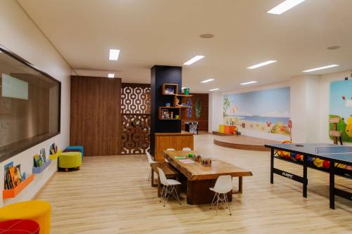 a room with a table and a ping pong table at Grand Hyatt Rio de Janeiro in Rio de Janeiro