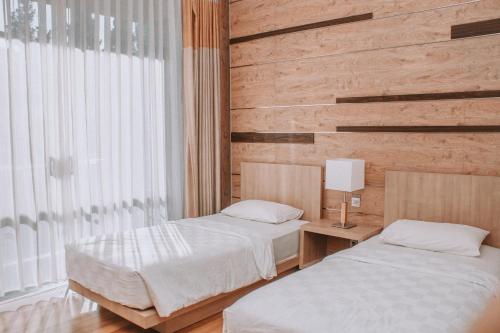Cama o camas de una habitación en Lembang Asri Resort