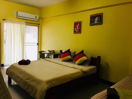 Кровать или кровати в номере Peamsuk Sweet Prachin Buri