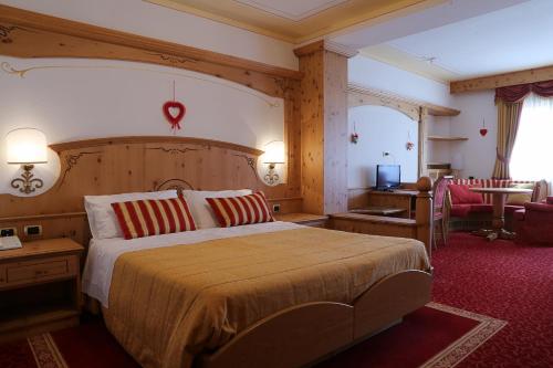 Säng eller sängar i ett rum på Hotel Belvedere Srl