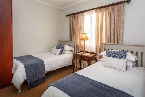 Una cama o camas en una habitación de Hazenjacht Karoo Lifestyle - TONNELKOP