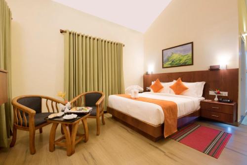 Postel nebo postele na pokoji v ubytování Indeevara Luxury Resort and Spa, Wayanad