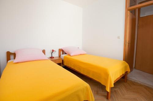 Posteľ alebo postele v izbe v ubytovaní Apartmani Stipe