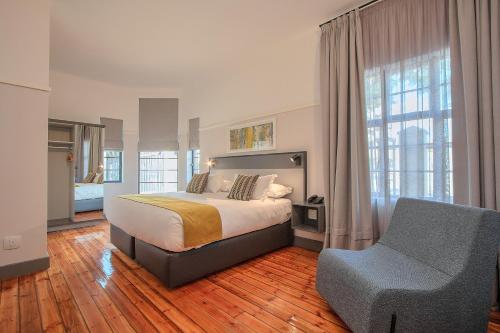 Voodi või voodid majutusasutuse THE Pretoria Hotel toas