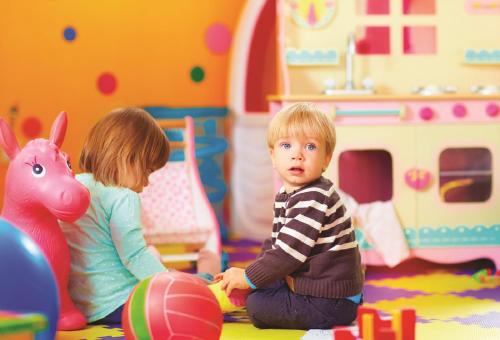 a boy and a girl playing in a toy store at Résidence Club MMV La Clé des Cimes in Arêches