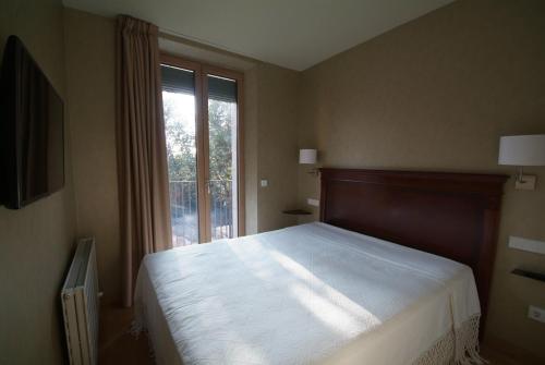 Postel nebo postele na pokoji v ubytování Beautifully furnished luxury apartment in Barri Vell, Girona
