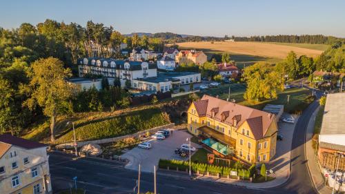 an aerial view of a small town with a street at Penzion Eduard in Františkovy Lázně
