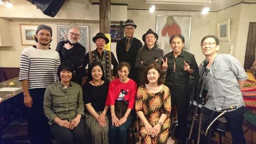 a group of people posing for a picture at Live Cafe Hisui no Umi in Itoigawa