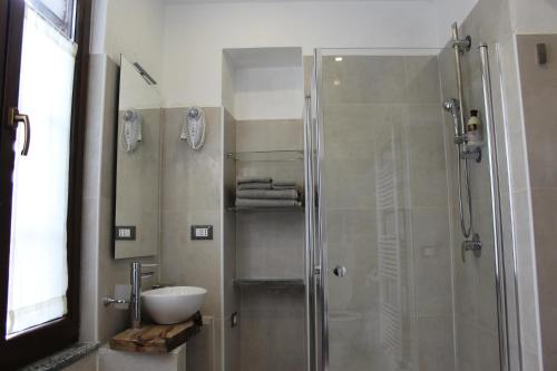 a bathroom with a shower and a sink at Passaggio a Nord Ovest in Settimo Vittone