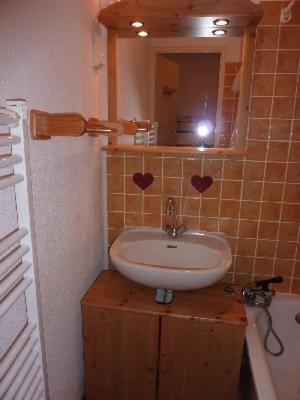 a bathroom with a sink and a mirror at MONT BLANC Soleil B-4 in Manigod