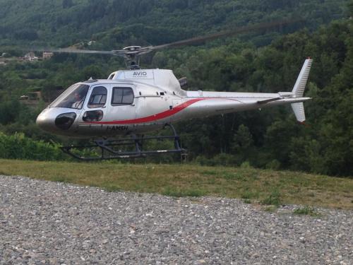 a small helicopter is flying over a field at Agriturismo Polla in Camporgiano