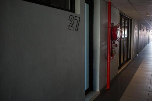 a fire hydrant on the side of a hallway at Apartment 27 in Windhoek