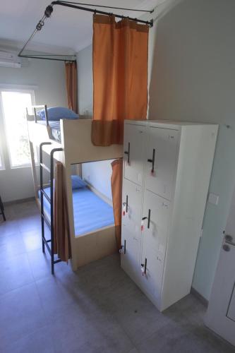 Postel nebo postele na pokoji v ubytování Beach Hut Hostel