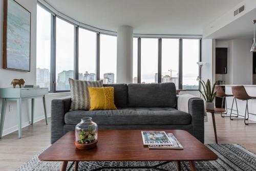 a living room with a couch and a table at Mint House Houston - Medical Center in Houston