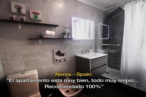 a bathroom with a toilet and a sink at LivingPorto Boavista in Porto